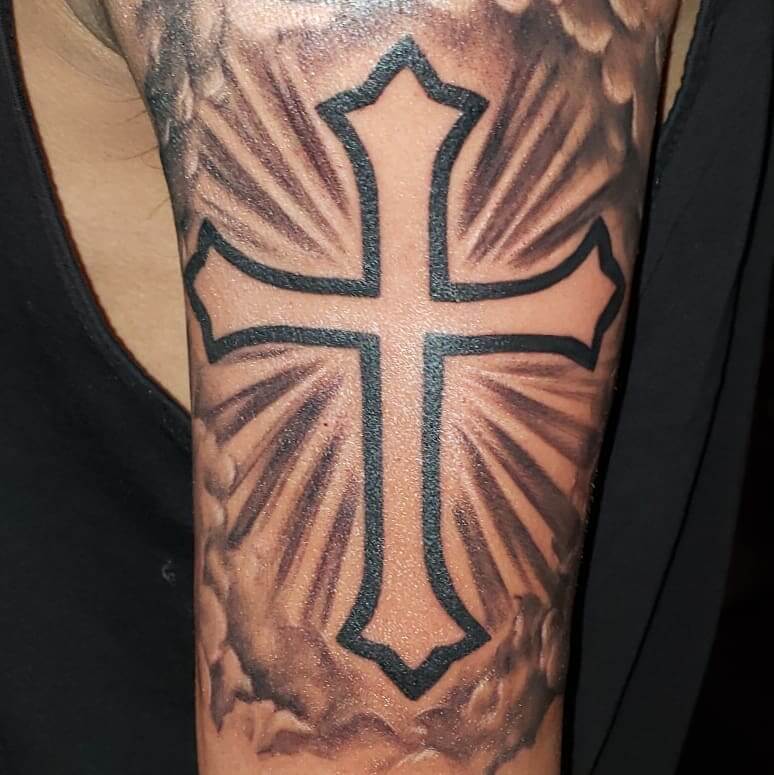 Cross with clouds tattoo