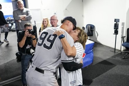 New York Yankees designated hitter Aaron Judge kisses his mother Patty Judge after hitting his 61st home run of the season against the Toronto Blue Jays on Wednesday, September 28, 2022 at the Rogers Center in Toronto, Canada.  Aaron Judge tied the American League and Yankees Club record with 61 home runs set by Roger Maris.MLB Yankees Blue Jays, Toronto, ON, Canada - September 25, 2022