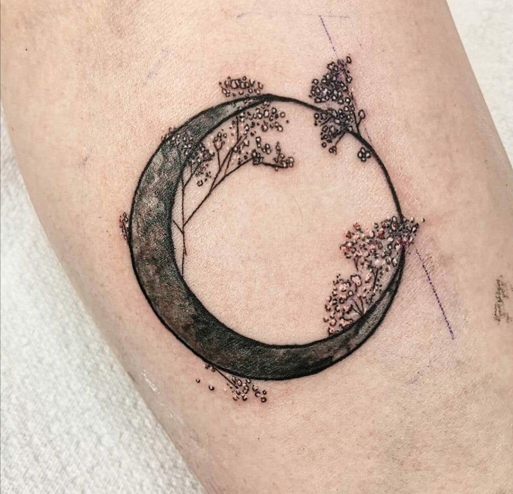 Aesthetic moon and baby breath tattoo