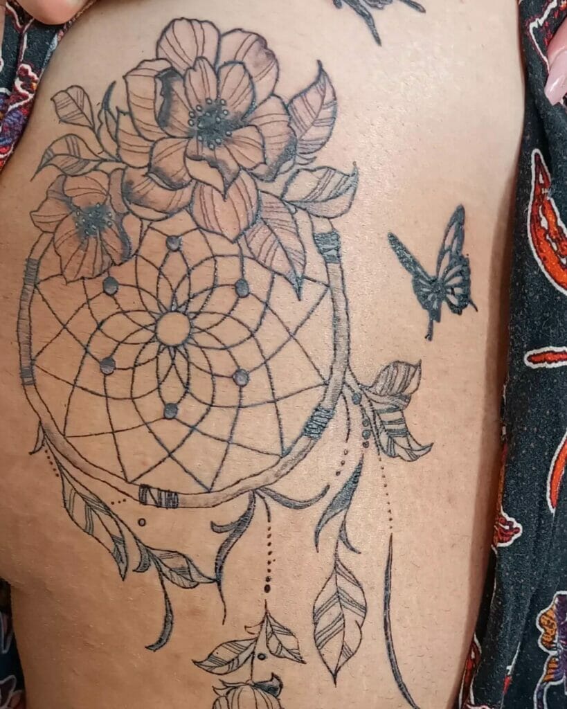 Detailed dream catcher with butterfly tattoo