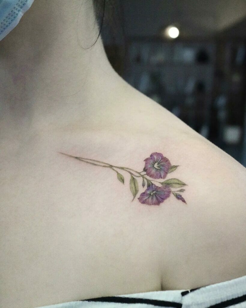 Watercolor style floral collarbone tattoos