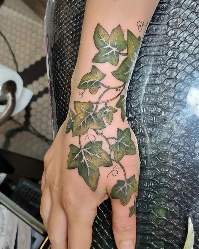 Beautiful green vine tendril tattoo around wrist