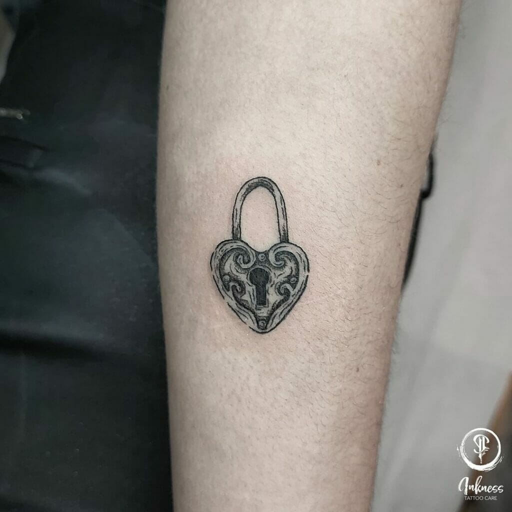 Black and white portrait heart medallion tattoos