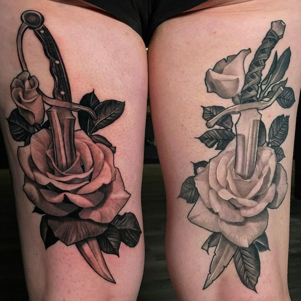 Black and gray rose tattoo with dagger
