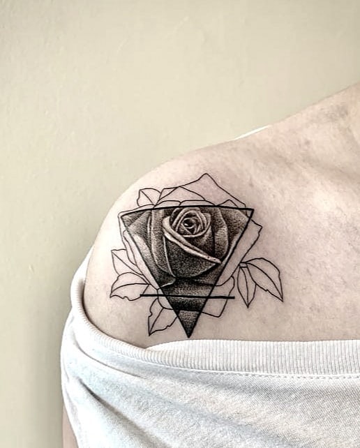 Black and gray rose tattoo with linework
