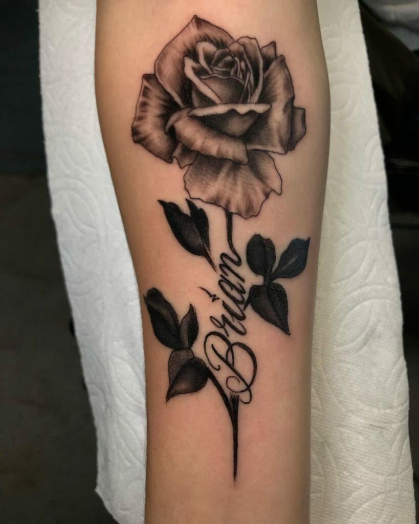 Black and gray rose tattoo with names