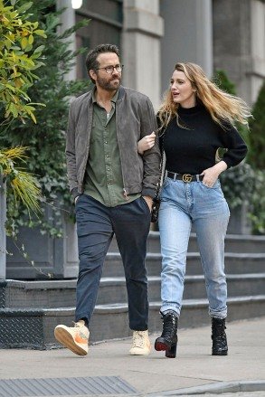 Blake Lively wears a black turtleneck paired with faded jeans, Gucci belted Louis Vuitton boots and matching shoulder bag while out on a romantic walk with Ryan Reynolds in New York City From: SplashNews.com Splash News and Pictures USA: +1 310-525-5808 London: +44 (0)20 8126 1009 Berlin: +49 175 3764 166 photodesk@splashnews.com World Rights
