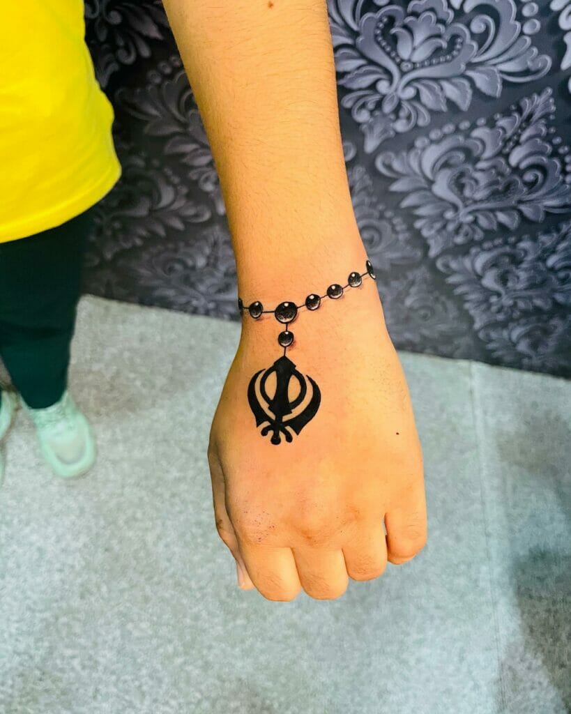 Bracelet Khanda tattoo on the wrist