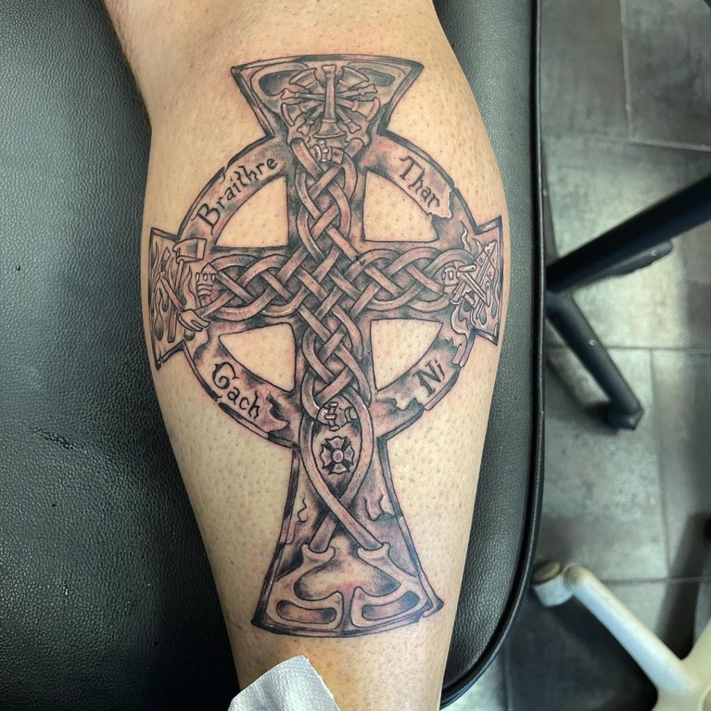 Celtic cross forearm tattoo