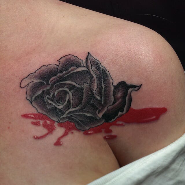 Dead rose tattoo with blood