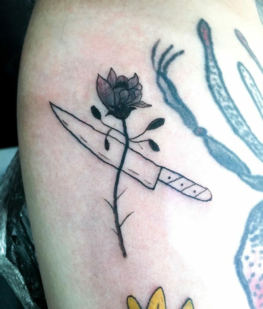 Dead rose tattoo with dagger