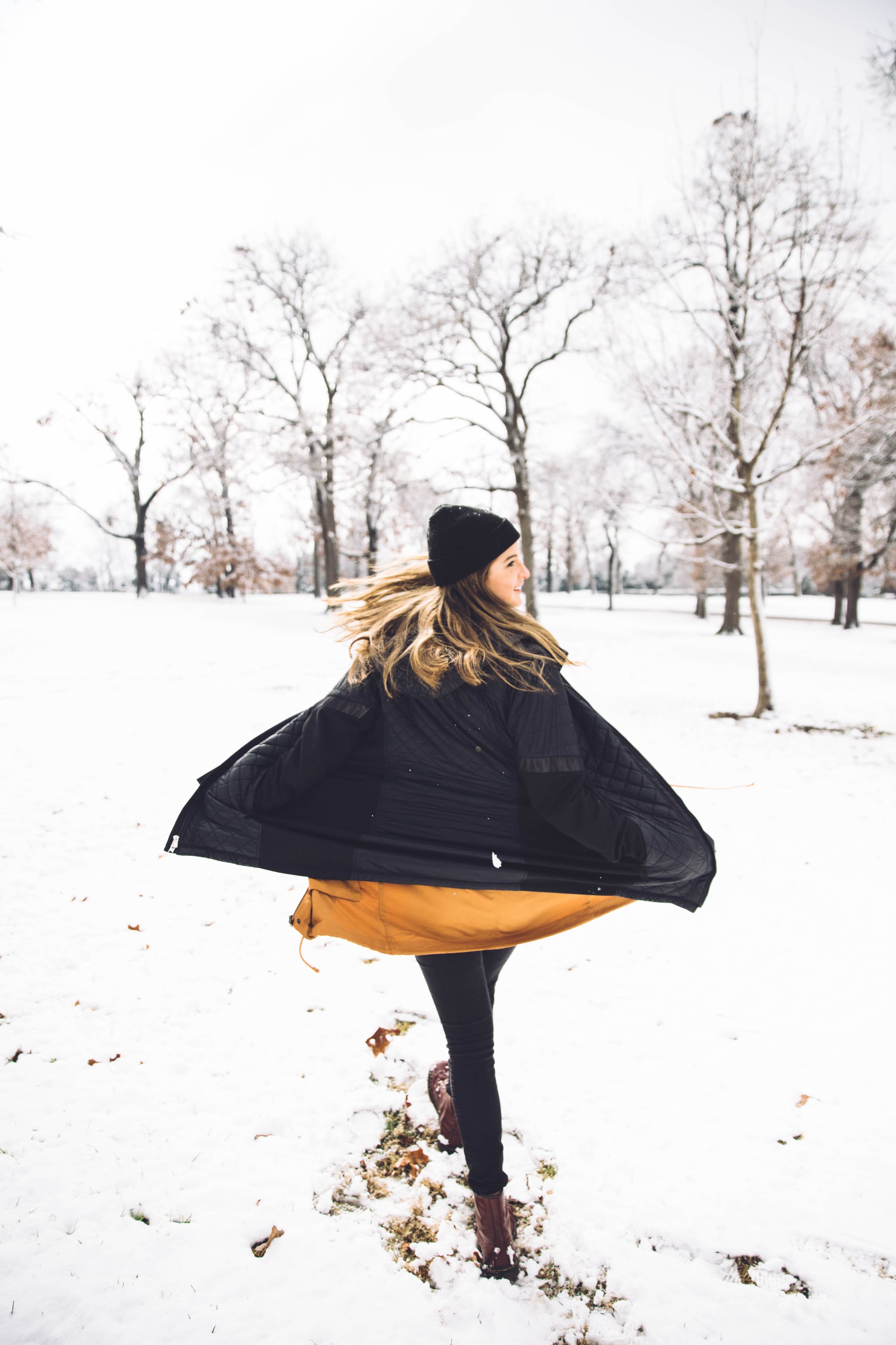 Woman walking in the snow during December New Moon in Capricorn