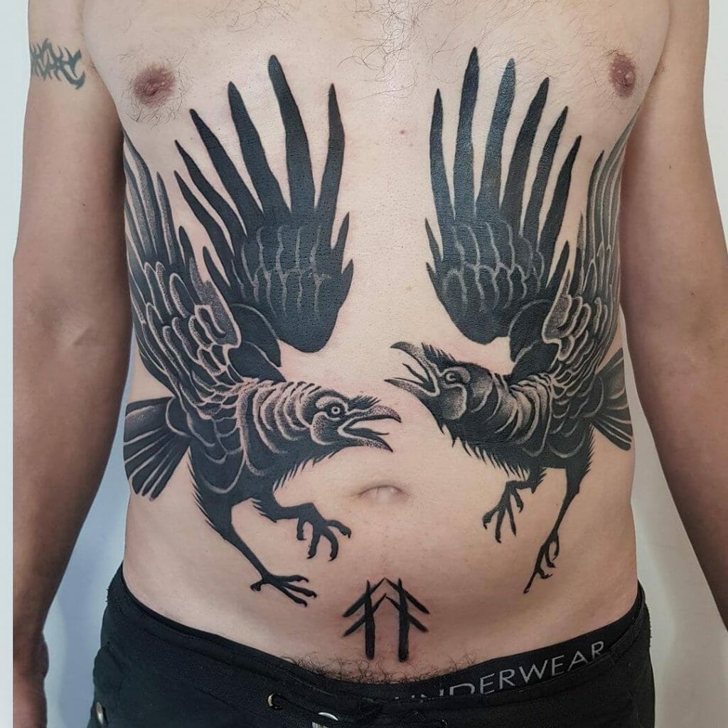 Detailed black Huginn and Muninn tattoo