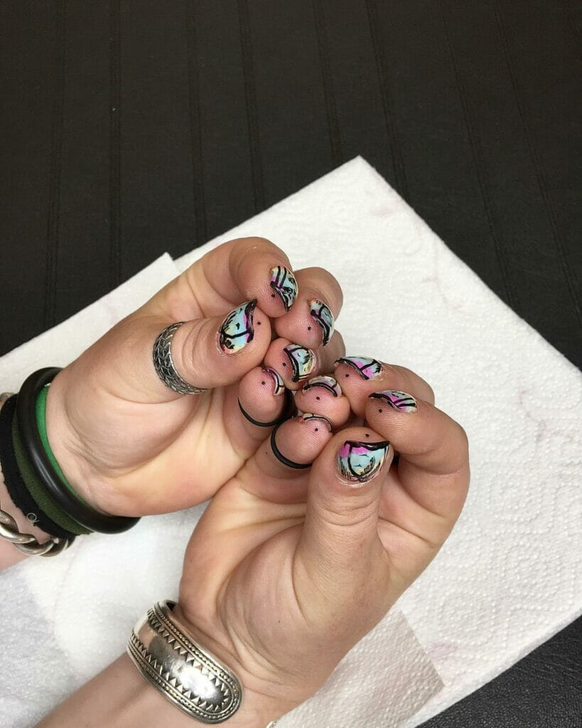 Dot tattoos on the tip of each finger