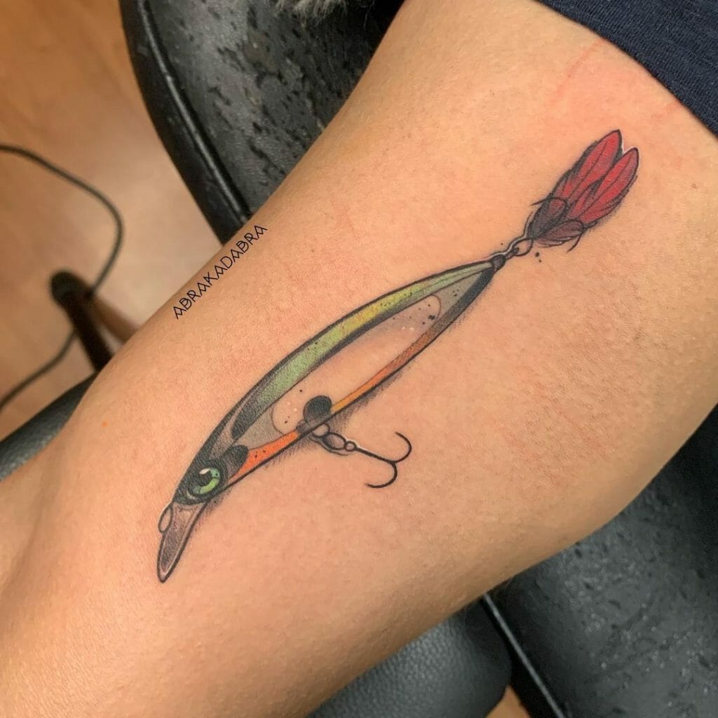 Fishing hook tattoo with a fish