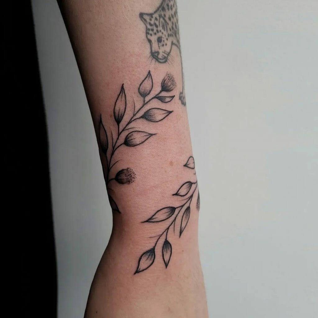 Gorgeous flower and vine tattoo