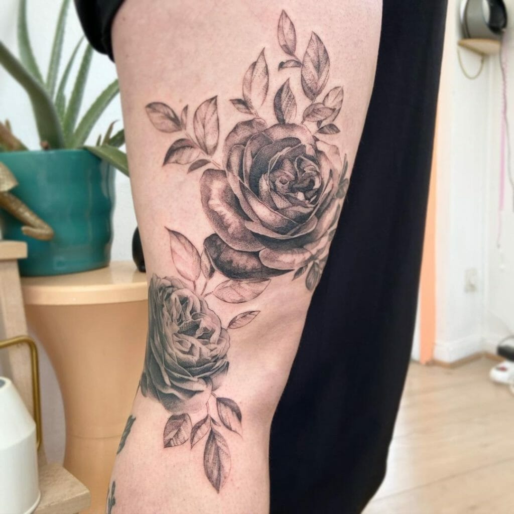 Intricate black and gray rose tattoo
