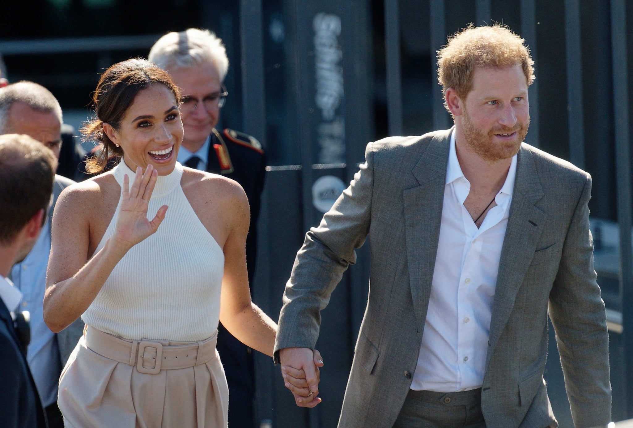 September 6, 2022, North Rhine-Westphalia, Düsseldorf: British Prince Harry (r), Duke of Sussex, and his wife Meghan, Duchess of Sussex, go to a car after a boat trip on the Rhine.  (recrop) The prince and his wife come to Düsseldorf to promote the year 2023 