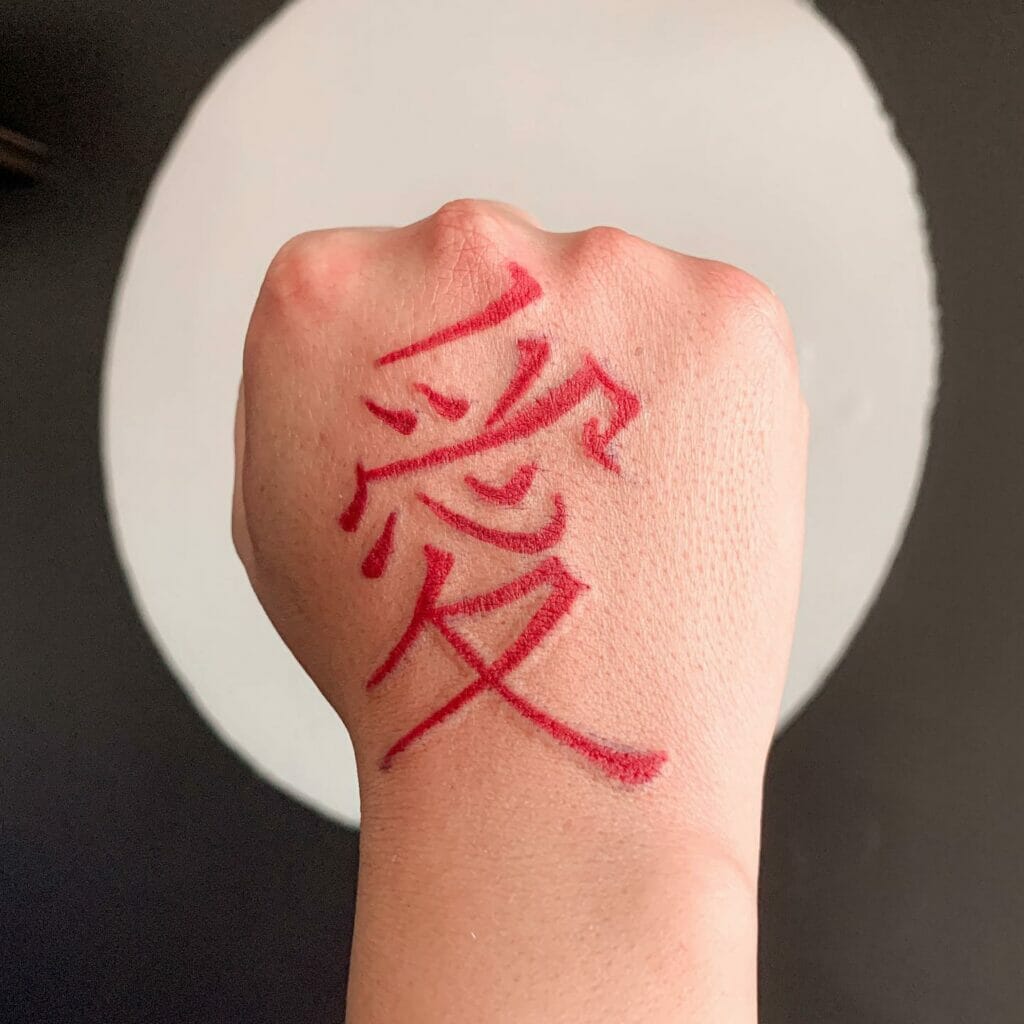 Japanese love kanji tattoo on the back of the palm