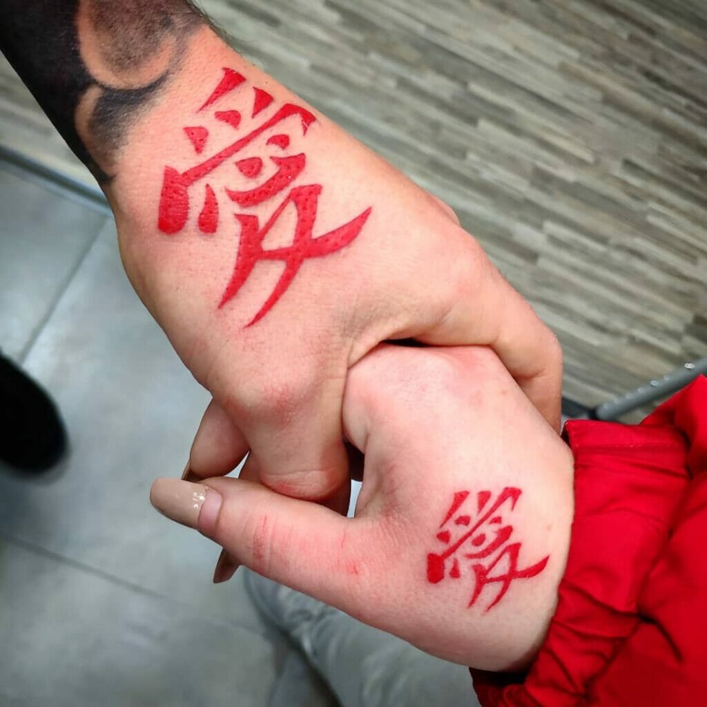 Japanese love kanji tattoo on side of palm