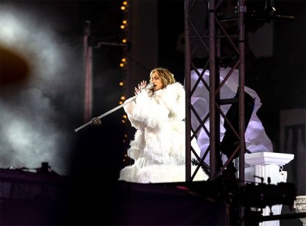 Jennifer Lopez performs in Times Square during the 2021 New Year's celebration.  Due to the COVID-19 pandemic, no revelers were allowed to linger in Times Square, with only a few key workers receiving special invitations and sitting in socially distanced pods.  2021 New Year's Celebration in Times Square, New York, United States - January 01, 2021