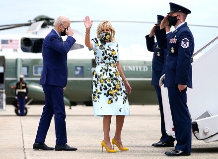 President Joe Biden salutes as he and First Lady Jill Biden board Air Force One to celebrate his 100th birthday