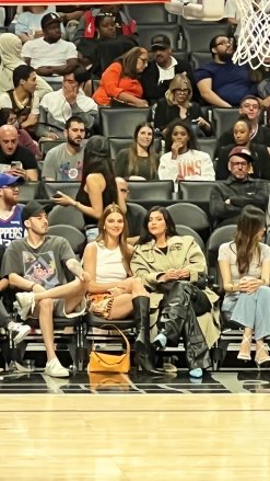 Los Angeles, CA - Kendall and Kylie Jenner sit courtside at the Clippers game and seem closer than ever as they spent the entire time talking and checking out the action on the court.  Kylie appeared to be sipping a margarita as she watched alongside her sister, who was there to support boyfriend Devin Booker.  Image: Kendall Jenner, Kylie Jenner Please pixelate face prior to publication*