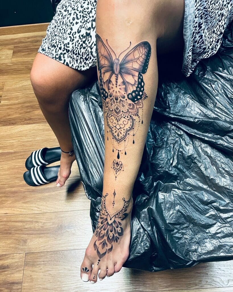 Lace mandala tattoo on full legs