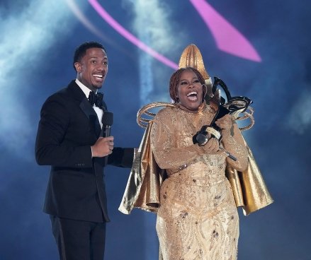 THE MASKED SINGER: LR: Host Nick Cannon and Amber Riley in THE MASKED SINGER episode “2 Hours Epic Season Finale Parts 1 & 2” airing Wednesday, November 30 (8pm-10pm ET /PT) is broadcast FUCHS.  © 2022 FOX Media LLC.  CR: Michael Becker / FUCHS.