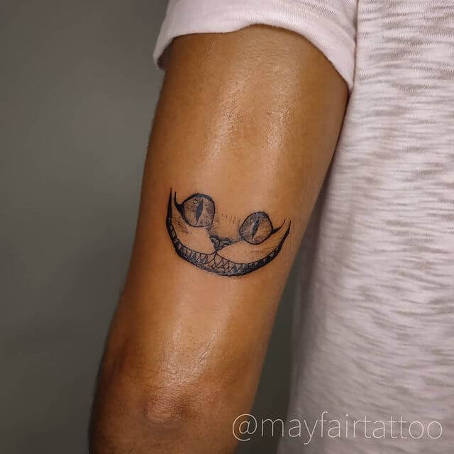 Minimalist 'Alice in Wonderland' tattoo