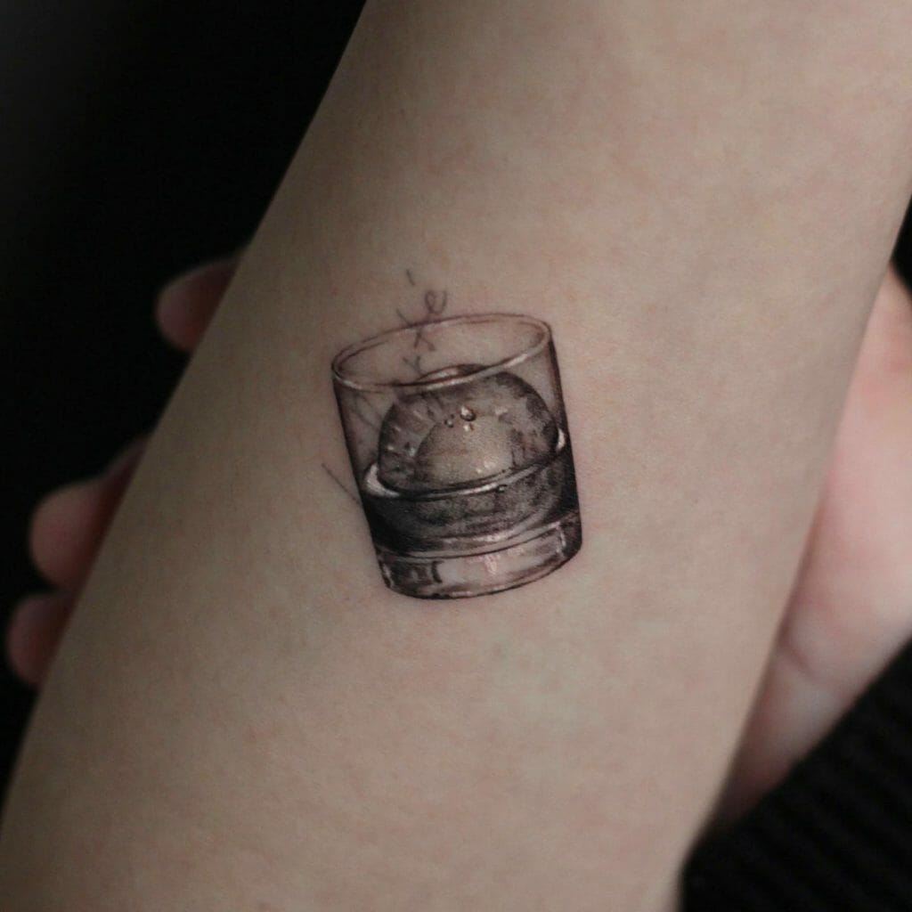 Minimalist whiskey glass tattoo