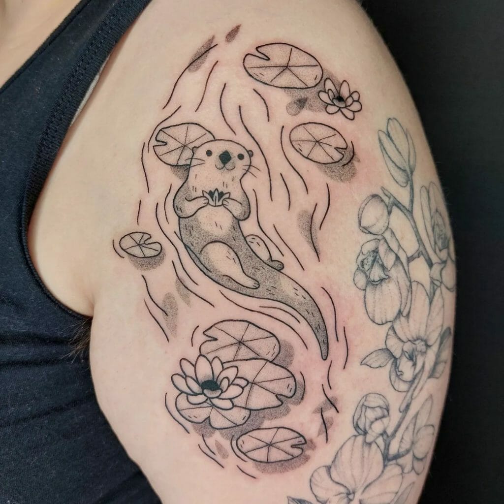 Otter tattoo in the water with flowers
