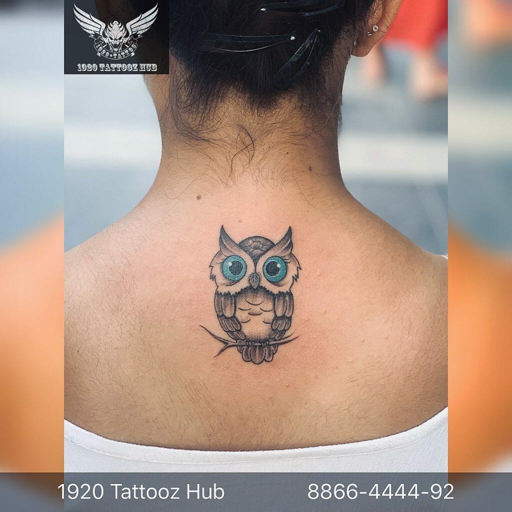 Owl with blue eye tattoo