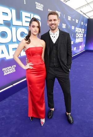 PEOPLE'S CHOICE AWARDS 2022 - Pictured: (l-r) Natalie Joy and Nick Viall arrive at the People's Choice Awards 2022 held at the Barker Hangar on December 6, 2022 - (Photo by: Todd Williamson/E! Entertainment/NBC)