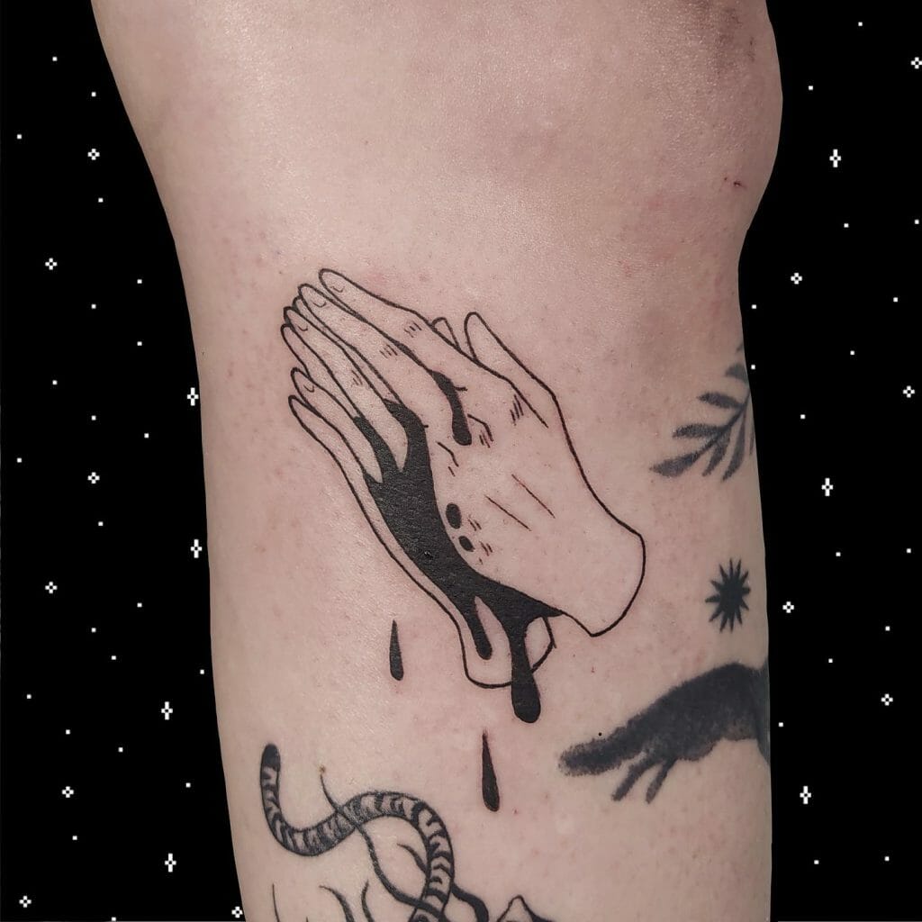 Praying hands tattoo