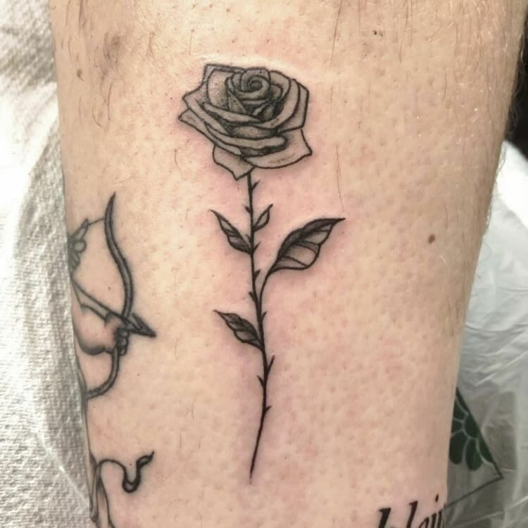 Simple black and gray rose tattoo