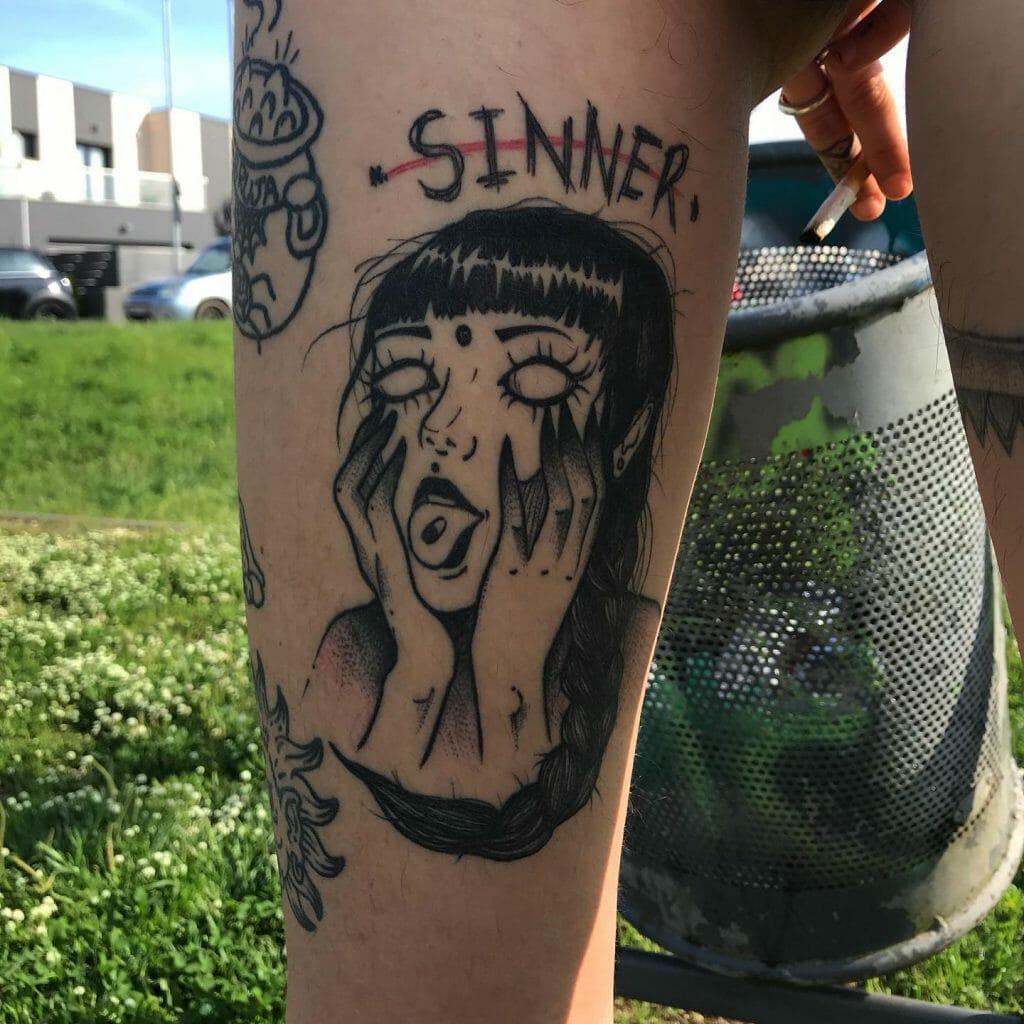 Sinner tattoo on thighs