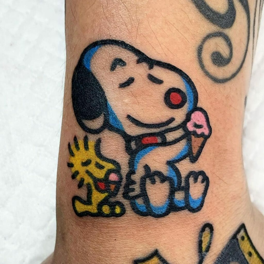 Snoopy eats ice cream with Woodstock tattoo