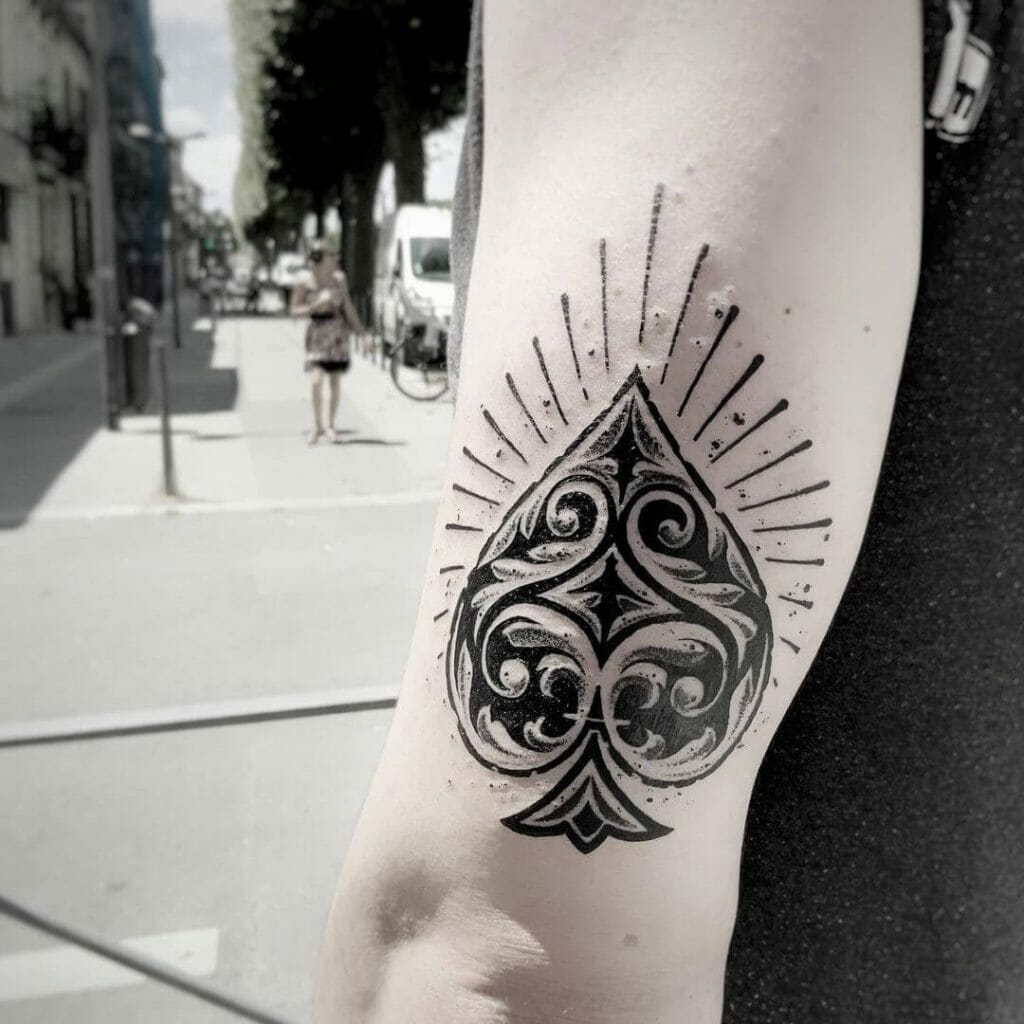 Spade tattoo with a feminine design