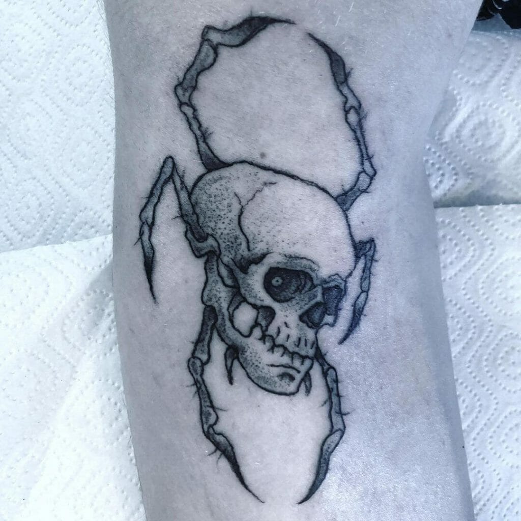 Spider with skull tattoo