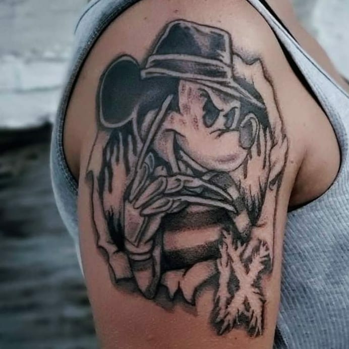The Freddy Krueger Mickey Mouse themed tattoo