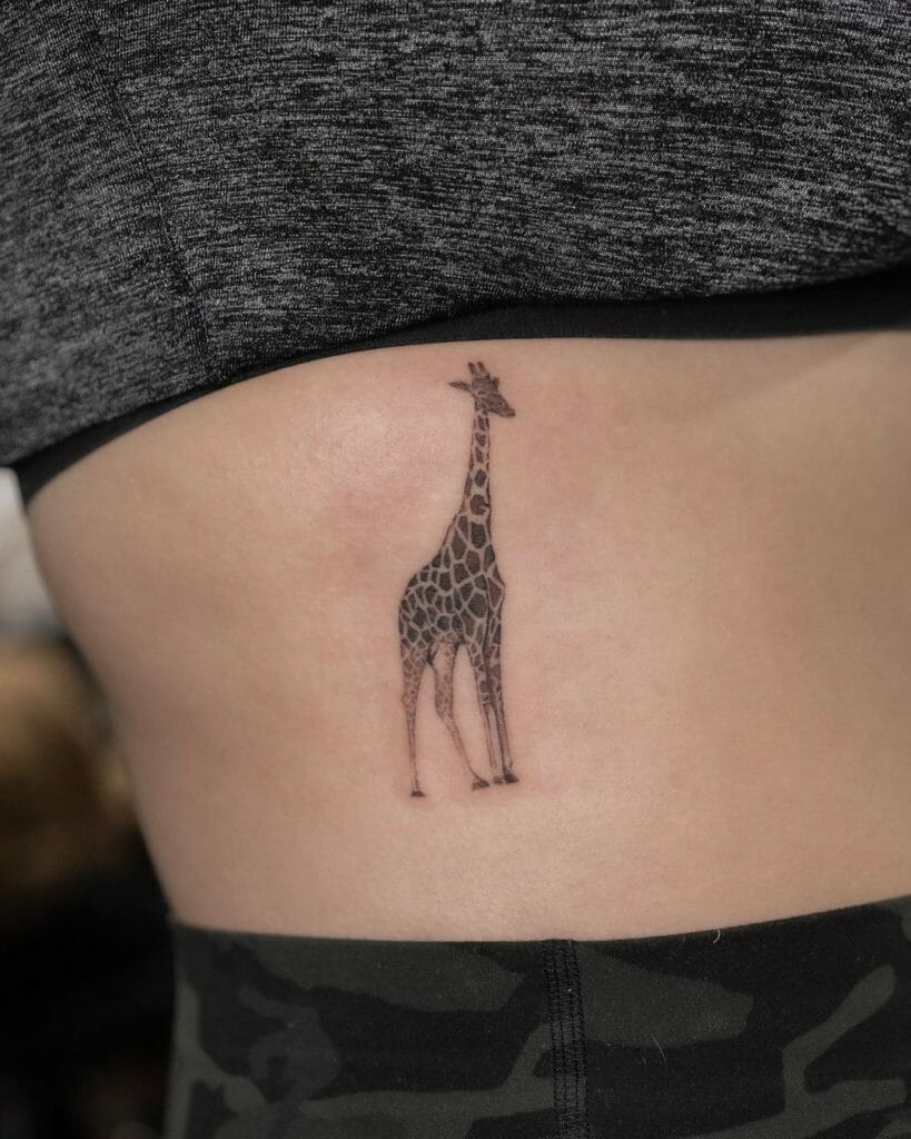 Small giraffe tattoo design