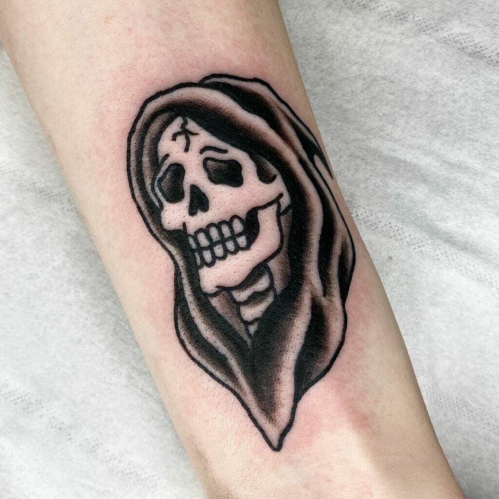 Traditional skull tattoo with the grim reaper
