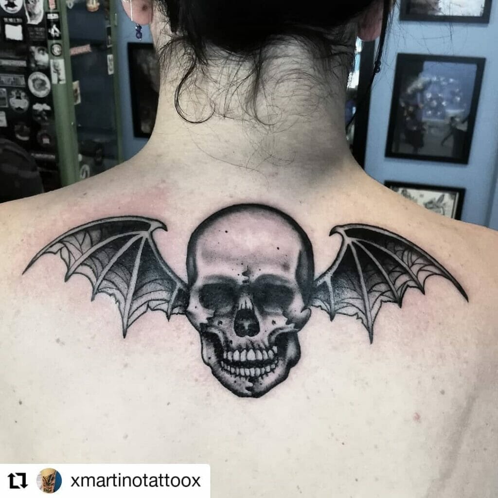 Traditional skull with wings tattoo