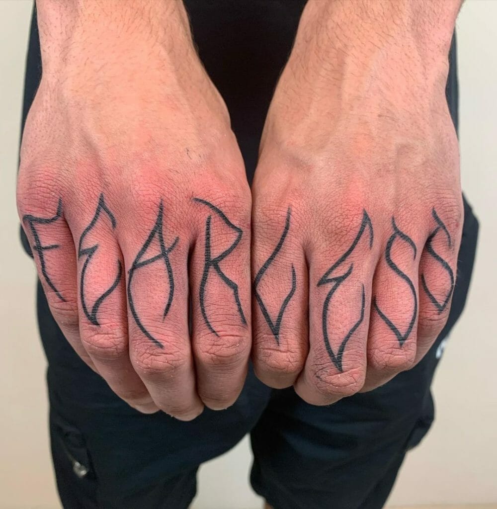 Unconventional Finger Tattoo Designs With The Word “Fearless”