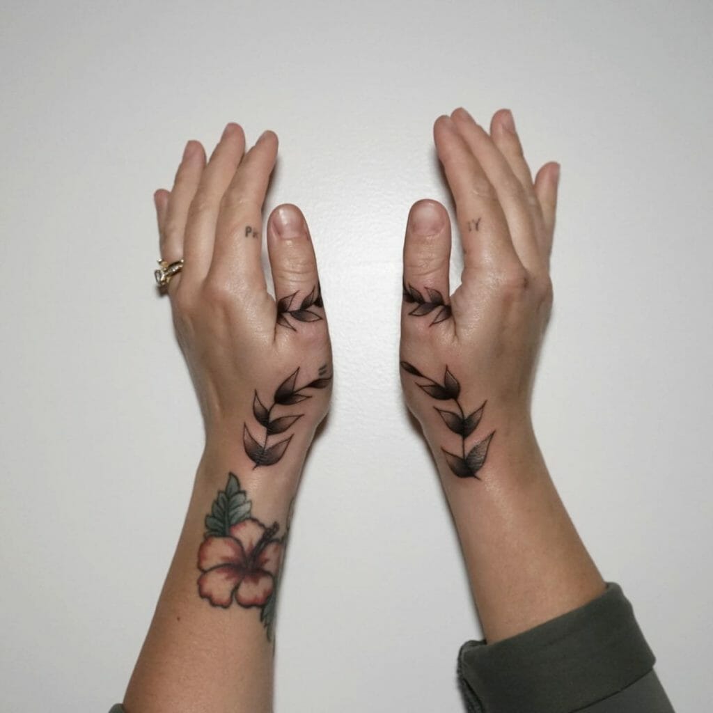 Vine tattoo around wrist and fingers