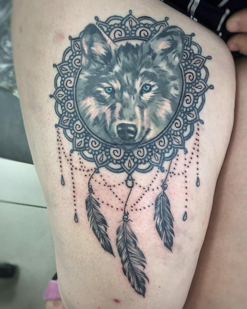 Wolf head in dream catcher tattoo