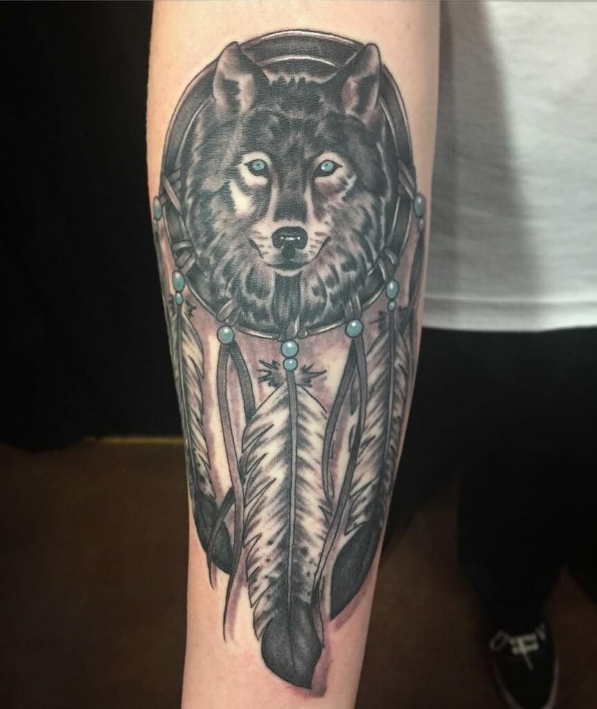 Wolf in dream catcher tattoo