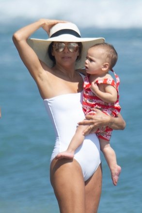 Eva Longoria takes the opportunity to walk on the beach with her son and take photos.  ***SPECIAL NOTES*** Please pixelate children's faces before publication.***.  07/09/2019 Pictured: EVA LONGORIA WITH HER SON.  Photo credit: MEGA TheMegaAgency.com +1 888 505 6342 (Mega Agency TagID: MEGA462204_004.jpg) [Photo via Mega Agency]