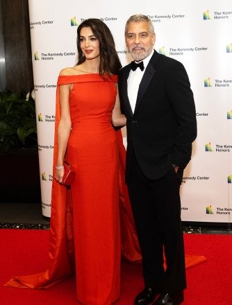 George Clooney and his wife Amal arrive at the formal Artist's Dinner honoring recipients of the 45th Annual Kennedy Center Honors at the State Department on Saturday, December 3, 2022 in Washington, DC.  The 2022 award winners are: actor and filmmaker George Clooney;  contemporary Christian and pop singer-songwriter Amy Grant;  legendary soul, gospel, R&B and pop singer Gladys Knight;  Cuban-born American composer, conductor, and educator Tania Le√≥n;  and legendary Irish rock band U2, consisting of band members Bono, The Edge, Adam Clayton and Larry Mullen Jr. Credit: Ron Sachs / Pool via CNP Pictured: George Clooney,Amal Clooney Ref: SPL5507657 031222 NON-EXCLUSIVE Picture by: Ron Sachs /CNP / SplashNews.com Splash News and Pictures USA: +1 310-525-5808 London: +44 (0)20 8126 1009 Berlin: +49 175 3764 166 photodesk@splashnews.com World rights, no rights in France